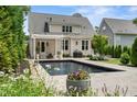 A stunning outdoor space featuring a pristine pool and landscaped backyard at 5811 Shawood Dr, Raleigh, NC 27609