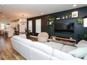 Stylish living room with modern decor and an open layout leading to the kitchen at 606 Great Ridge Pkwy, Chapel Hill, NC 27516