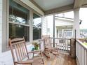 Relaxing front porch showcasing rocking chairs and inviting outdoor space at 606 Great Ridge Pkwy, Chapel Hill, NC 27516