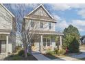 Charming two-story home with a welcoming front porch and well-maintained landscaping at 75 Mallard Landing Dr, Chapel Hill, NC 27516