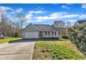 Inviting single-Gathering home boasting an attached garage and long driveway at 803 Trail Stream Way, Knightdale, NC 27545