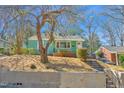 View of a quaint single-story home featuring a small front porch at 810 Cox Ave, Durham, NC 27701