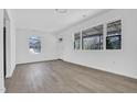 Bright living room features modern floors, neutral paint, and large windows at 810 Cox Ave, Durham, NC 27701