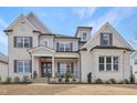 Charming two-story home features a welcoming front porch and meticulously maintained landscaping at 83 Inspiration Way, Fuquay Varina, NC 27526