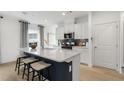 Stylish kitchen with a central island with seating and modern stainless steel appliances at 1117 Everton Ave, Durham, NC 27703