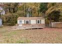 Charming home with wheelchair ramp, siding and small fenced yard at 164 Torain St, Hillsborough, NC 27278