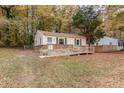 Home exterior with wheelchair ramp, siding and small fenced yard at 164 Torain St, Hillsborough, NC 27278