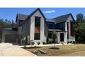 Beautiful two-story home with modern color scheme, including a gray garage and well-kept landscaping at 170 Cherry Bark Dr, Youngsville, NC 27596