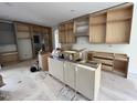 Spacious kitchen featuring wood cabinets and drawers ready for installation at 170 Cherry Bark Dr, Youngsville, NC 27596