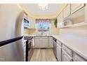 Efficient kitchen features ample counter space, stainless appliances, and bright, cheerful decor at 1805 Lawrence Rd, Hillsborough, NC 27278