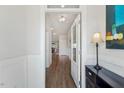 Inviting foyer with hardwood floors, white wainscoting and glass paneled door at 190 Salem Village Dr, Fuquay Varina, NC 27526