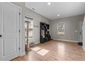 Bright entryway with hardwood floors, coat rack and ample natural light at 20 W Park Ln, Sanford, NC 27332