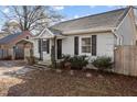Traditional home features a covered carport and mature landscaping at 211 W Sycamore, Zebulon, NC 27597
