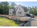 Striking two-story new construction home with brick and siding and an attached garage at 2957 Wexford Pond Way, Wake Forest, NC 27587