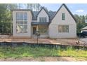 Striking two-story new construction home with brick and siding and an attached garage at 2957 Wexford Pond Way, Wake Forest, NC 27587