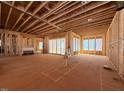 Unfinished living room showcases an open-concept design with sliding glass doors to provide natural light at 2957 Wexford Pond Way, Wake Forest, NC 27587