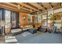 Relaxing covered patio features cozy seating and decor for outdoor enjoyment at 300 Lakeside Dr, Garner, NC 27529