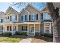 Attractive townhome with a quaint front porch and lovely architectural details at 4011 Volkswalk Pl, Raleigh, NC 27610