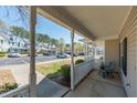 Relaxing porch seating area provides a peaceful outdoor living space in this townhome community at 4011 Volkswalk Pl, Raleigh, NC 27610