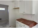 Spacious kitchen featuring bright white cabinets with elegant silver hardware at 4013 Kingcraig Ln, Zebulon, NC 27597