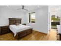 Comfortable bedroom with a wooden bed frame, hardwood floors, and plenty of natural light at 402 Chavis Way, Raleigh, NC 27601