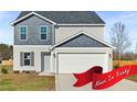 Charming two-story home with a two-car garage and neutral-toned siding at 41 Alderman Ct # 2, Dunn, NC 28334