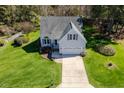 Overhead shot of a house with beautiful green lawns, mature trees and an attached two-car garage at 4108 4108 Gallatree Ln, Raleigh, NC 27616