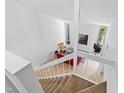 Bright living room with high ceilings, large windows and modern decor and stairwell at 4633 Edwards Mill Rd, Raleigh, NC 27612