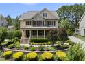 Charming two-story home with a welcoming front porch and beautiful landscaping at 512 Hallburg Ct, Wake Forest, NC 27587