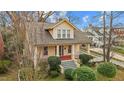 Inviting two-story home featuring a cozy front porch and neatly landscaped front yard at 529 Hillcrest Ave, Burlington, NC 27215