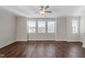 Spacious living room with natural light, hardwood floors, and crown molding at 5320 River Reach Dr, Raleigh, NC 27616