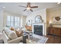 Serene living room featuring a fireplace, neutral color palette, and stylish furnishings creating an inviting atmosphere at 590 Grand Central Sta, Apex, NC 27502