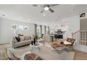 Open-concept living space filled with natural light, connects kitchen, dining, and living areas at 6002 Enclosure Way, Durham, NC 27703