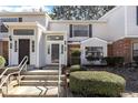 Exterior shot of a home featuring light siding, brick accents, and well-maintained landscaping at 7706 Falcon Rest Cir, Raleigh, NC 27615