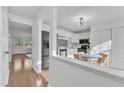 Open concept kitchen with modern stainless steel appliances and a breakfast nook adjacent to the living space at 7727 Ohmann Ct, Raleigh, NC 27615