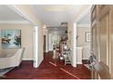Elegant foyer with hardwood floors, crown molding, and views into other rooms, creating a welcoming entrance at 9 Water Stone Ct, Durham, NC 27705