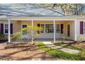 Inviting front porch offering a cozy entrance with landscaped surroundings at 901 Emory Ln, Raleigh, NC 27609