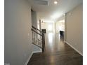 Bright hallway with hardwood floors and a view into the open-concept living space at 110 Manor Stone Dr, Clayton, NC 27527