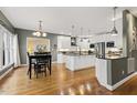 Bright kitchen with hardwood floors, an island, and stainless steel appliances at 113 Valley Ln, Pittsboro, NC 27312