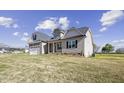 Charming single-Gathering home with manicured lawn, stylish siding, and attached garage at 115 S Harper Faith Way, Benson, NC 27504