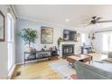 Cozy living room with fireplace, natural light and hardwood floors at 116 Lakeshore Dr, Durham, NC 27713