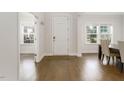 Bright foyer with hardwood floors, white walls, and natural light at 117 Gravel Brook Ct, Cary, NC 27519