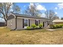 Charming single-story home with black shutters and a well-manicured lawn at 1230 Melrose Dr, Burlington, NC 27217