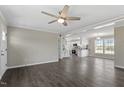 Open-concept living area with hardwood floors, ceiling fan, and abundant natural light at 176 Clear Water Dr, Smithfield, NC 27577