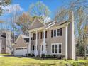 Charming two-story home with a well-manicured lawn, attached two car garage, and welcoming front porch at 3428 Singleleaf Ln, Raleigh, NC 27616