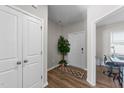 Bright foyer features hardwood floors, closet, and view of an office at 35 Wolf Ridge Ct, Willow Springs, NC 27592