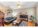 Cozy living room featuring hardwood floors, stylish decor, and plenty of natural light at 3504 Griffice Mill Rd, Raleigh, NC 27610