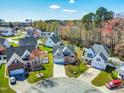 Aerial view of a neighborhood showcasing well-maintained homes and lush green spaces at 4005 Freesia Ct, Zebulon, NC 27597