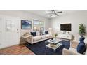 Bright living room featuring modern furniture, a large window, and stylish decor at 417 Sapphire Rd, Burlington, NC 27215