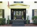 Inviting home entrance with wreaths on the black double doors and lantern lighting at 509 Queensferry Rd, Cary, NC 27511